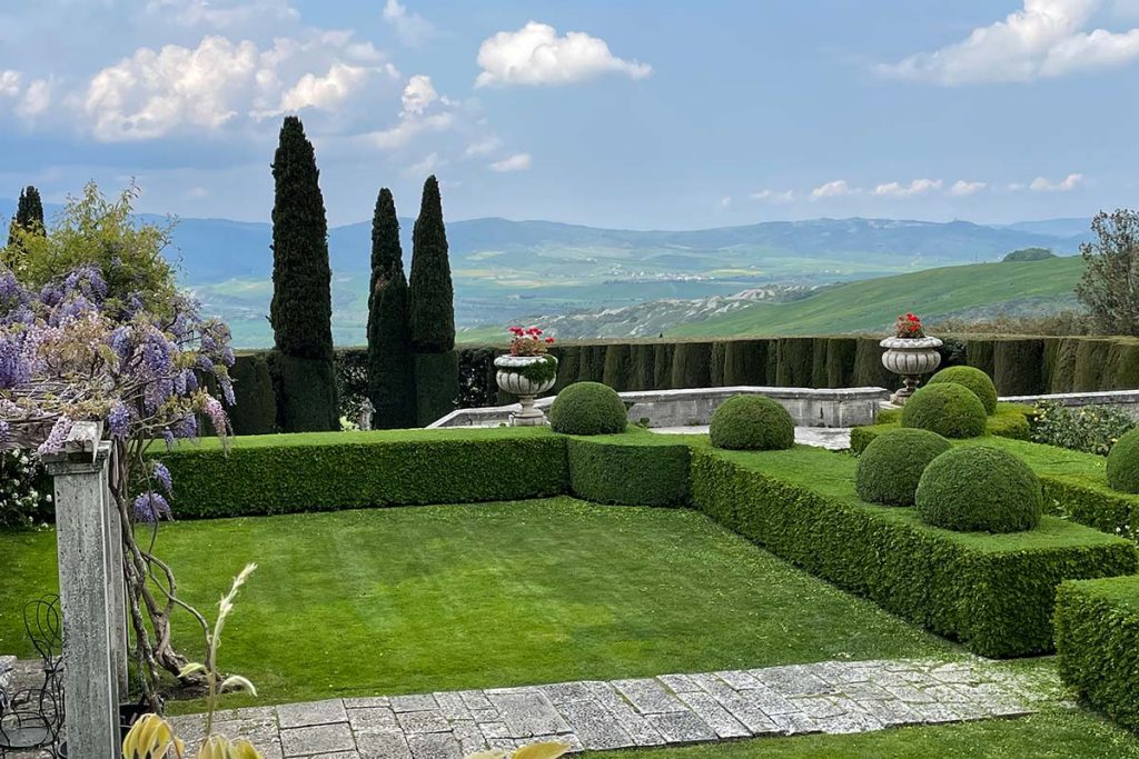 Formal garden view to distant hills in Tuscany